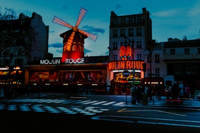 A street scene with a windmill in the background
