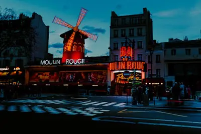 A street scene with a windmill in the background