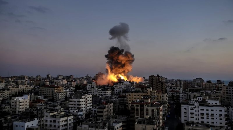 A large fire is burning in a city